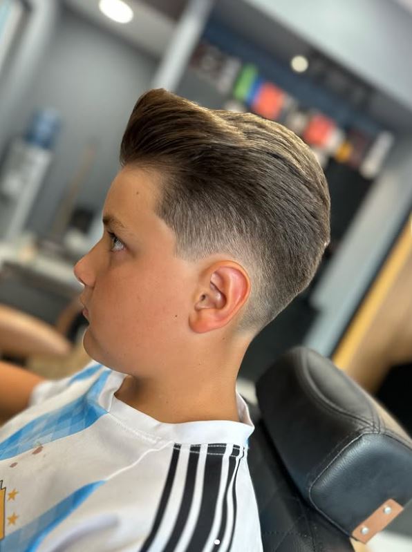 Precision boy's fade and swept-back haircut