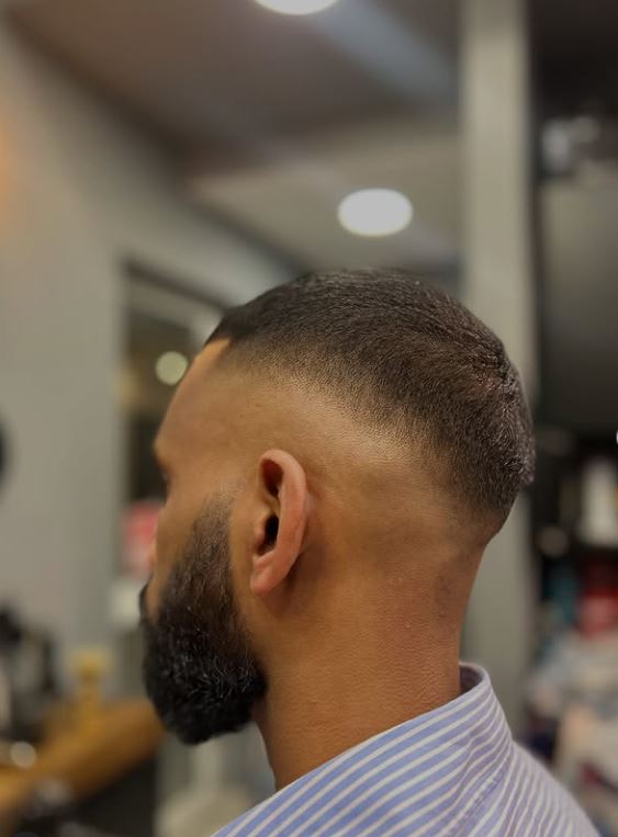 Skin fade with a shaped beard